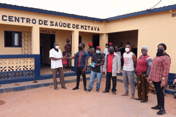 community-standing-in-front-of-health-center